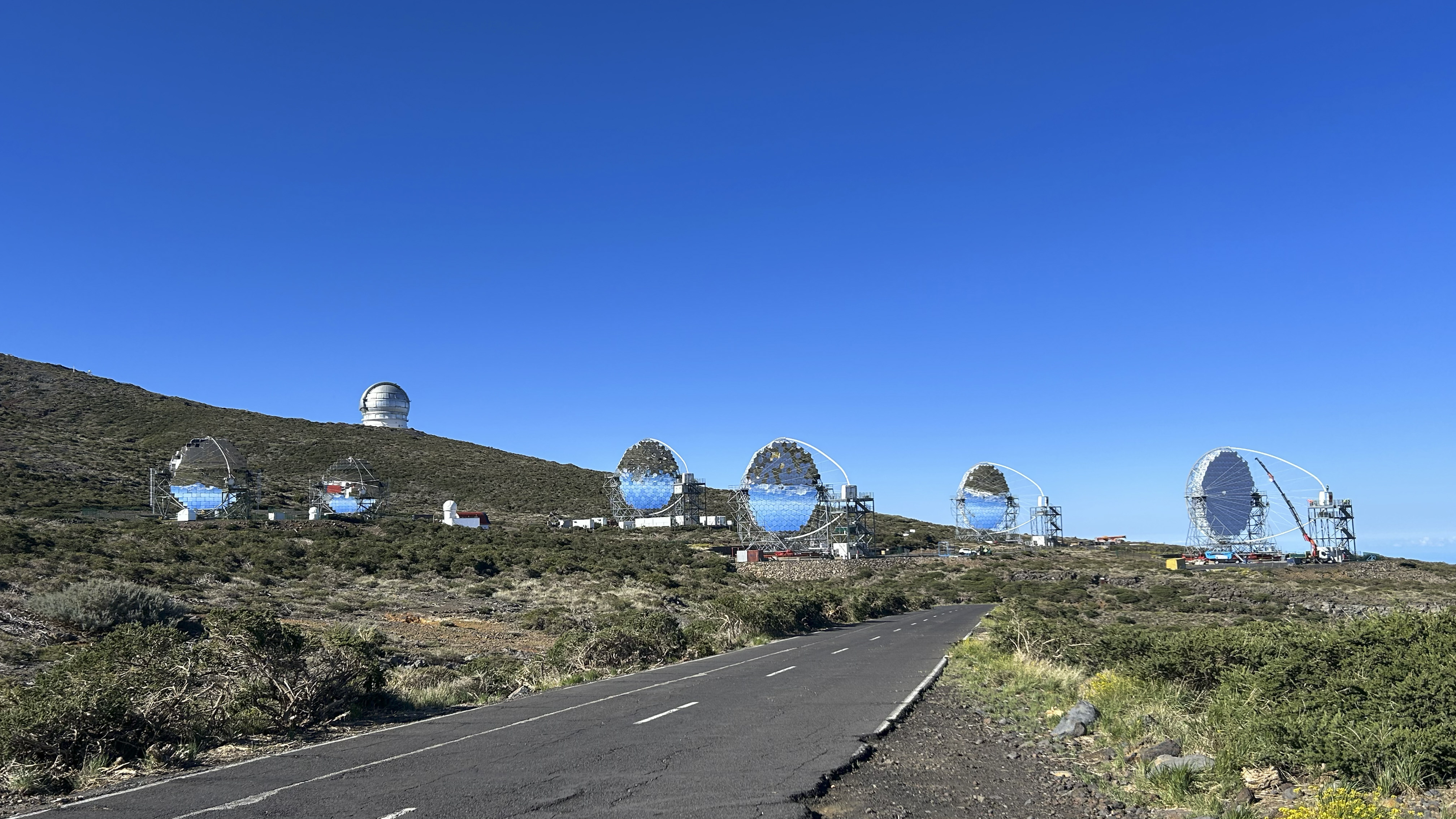  The 4 LSTs (right) of CTAO-North, located in the Roque de los Muchachos Observatory. Next to them, the MAGIC telescopes (left) and the optical telescopes GTC and TNG (back)