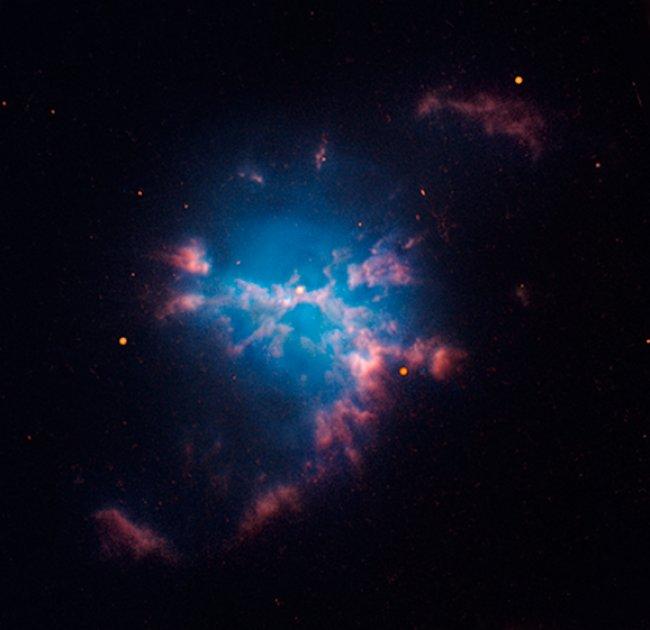 Two stars so close that they are almost touching found inside a planetary nebula