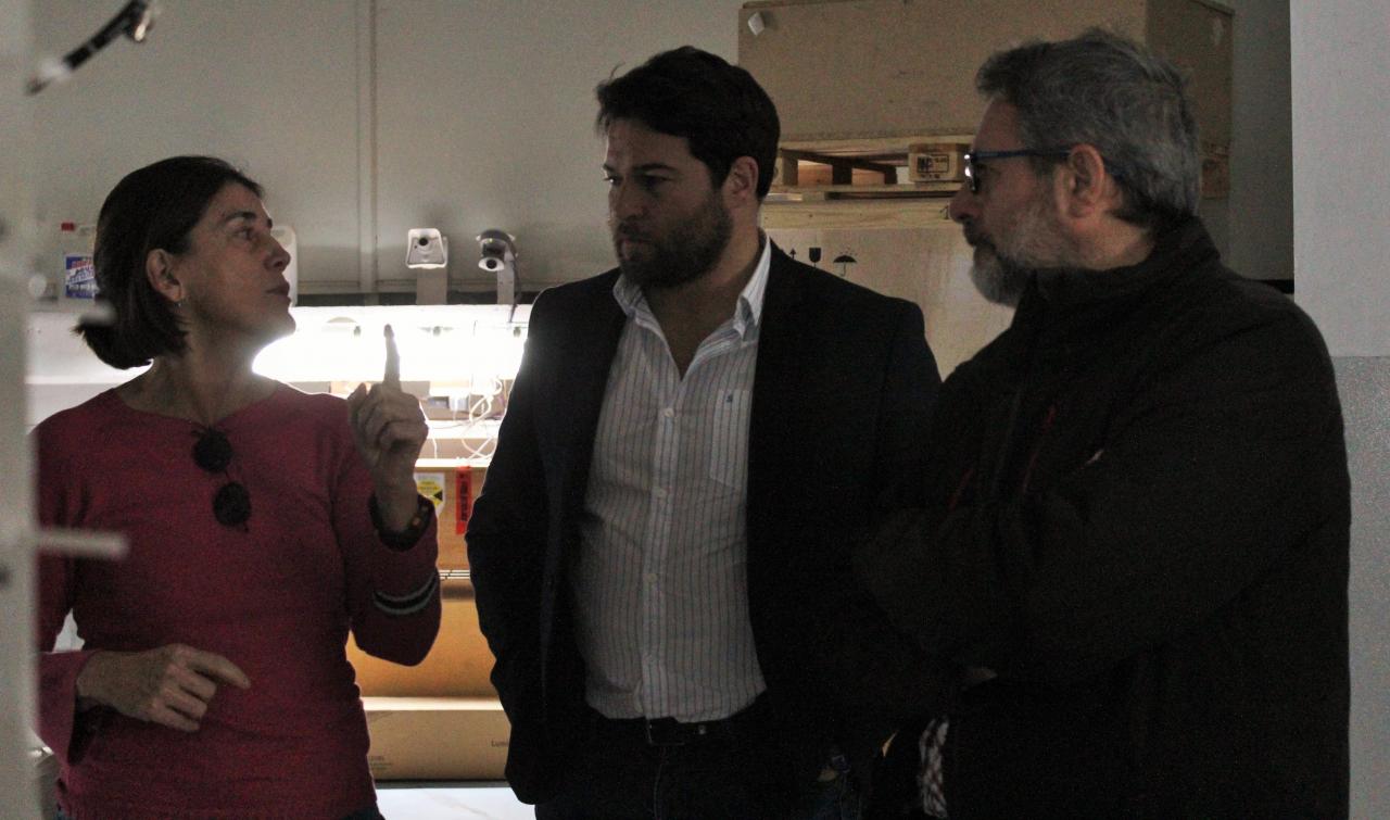 The deputy director of the IAC, the mayor of Güímar and the manager of the Teide Observatory inside the dome of the Optical Ground Station