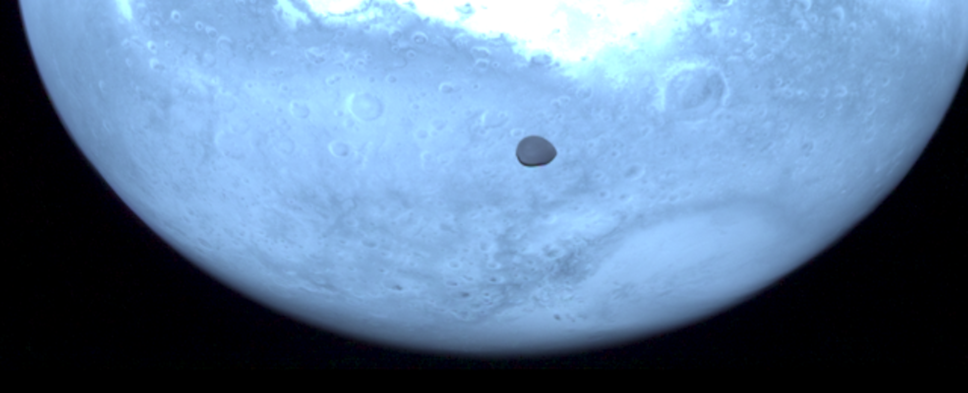 Image of Deimos with Mars on the background, obtained with the HyperScout-H instrument on board the Hera spacecraft 
