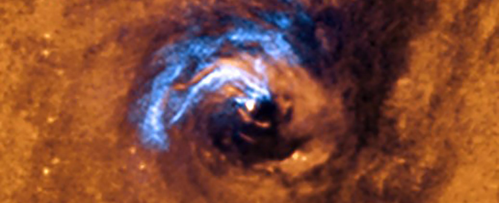 The image shows the process of nuclear feeding of a black hole in the galaxy NGC 1566, and how the dust filaments, which surround the active nucleus, are trapped and rotate in a spiral around the black hole until it swallows them. Credit: European Southern Observatory (ESO). The image shows the process of nuclear feeding of a black hole in the galaxy NGC 1566, and how the dust filaments, which surround the active nucleus, are trapped and rotate in a spiral around the black hole until it swallows them. Credit: European Southern Observatory (ESO).