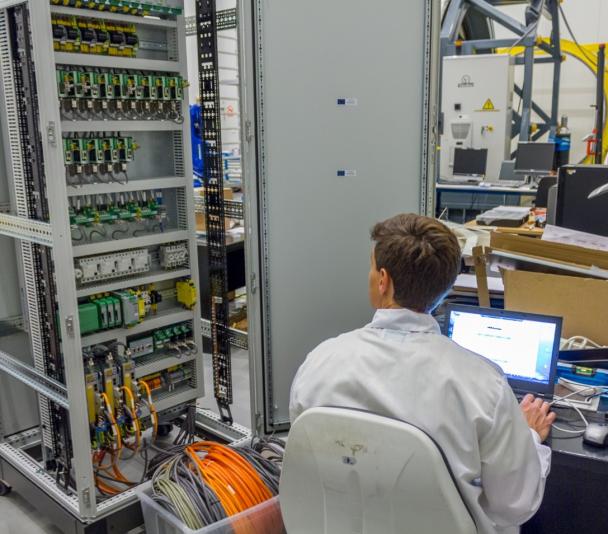 View of an engineer working on the electronic system of an instrument