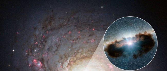 Galaxy NGC 1068 can be seen in close-up in this view from NASA's Hubble Space Telescope. This active black hole -shown as an illustration in the zoomed-in inset- is one of the most obscured known, as it is surrounded by extremely thick clouds of gas and d