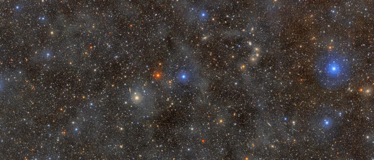 Ocean of Stars: The faint, glowing clouds spread across this image are galactic cirrus: clouds of interstellar gas and dust that can be seen in the foreground of the Milky Way