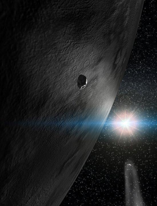 Artist conception of asteroid 24 Themis and two small fragments of this dynamical family, which resulted from a large impact more than one billion years ago. Note that one of the small fragments is inert (as most asteroids are) and the other has a comet-l