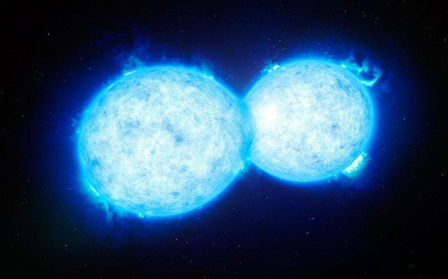 Artist's impression of VFTS 352, the hottest and most massive double star system to date where the two components are in contact and sharing material.Credits: ESO/L. Calçada