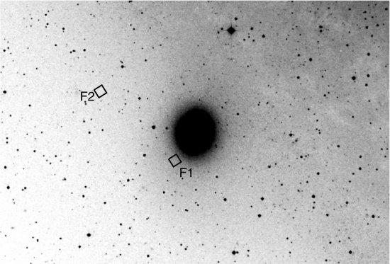 Fields observed with HST for M32 (F1) and M31 (F2) overplotted on a M32 image from ground.