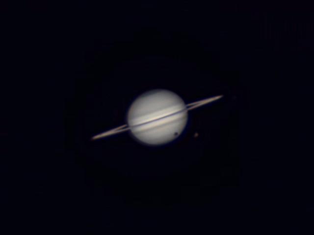 Solar eclipse produced by Titan over Saturn
