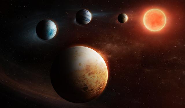Artist impression of a planetary system with four planets, around a small red star, called LHS1903
