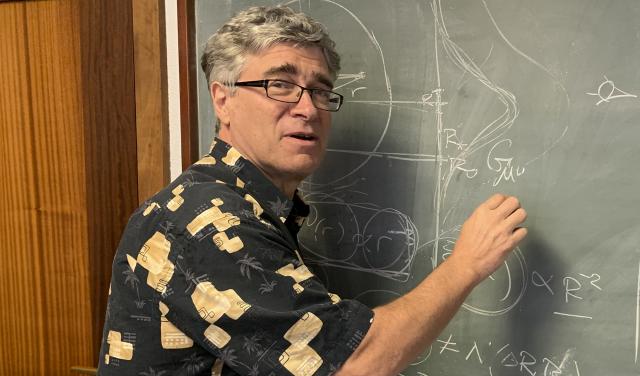Jeffrey R. Kuhn, from University of Hawaii Jeffrey R. Kuhn, writing on a blackboard during his visit the IAC.