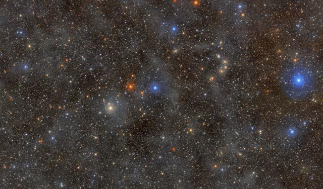 Ocean of Stars: The faint, glowing clouds spread across this image are galactic cirrus: clouds of interstellar gas and dust that can be seen in the foreground of the Milky Way