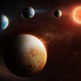 Artist impression of a planetary system with four planets, around a small red star, called LHS1903