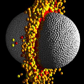 Colisión gigante en el sistema planetario Kepler 107 Esfera gris compuesta de pequeñas esferas, y rodeada de un anillo e esferas amarillas