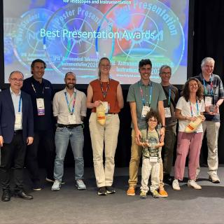 Elvio Hernández Suárez poses with other award recipients at SPIE Astronomical Telescopes + Instrumentation 2026.