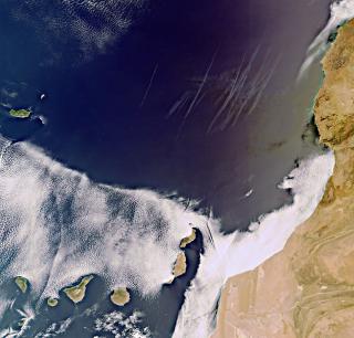 The subtropical Canary Islands off Africa’s west coast are pictured in this image, acquired on 8 September 2011 by Envisat’s Medium Resolution Imaging Spectrometer (MERIS). To the north, multiple contrails can be seen over the dark blue water. To the east The subtropical Canary Islands off Africa’s west coast are pictured in this image, acquired on 8 September 2011 by Envisat’s Medium Resolution Imaging Spectrometer (MERIS). To the north, multiple contrails can be seen over the dark blue water. To the east