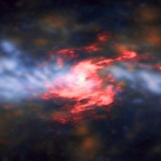 Combined image of the active galaxy NGC 5643 from ALMA and VLT/MUSE data. The galaxy’s central region has two distinct components: a spiraling, rotating disc (in red) of cold molecular gas traced by carbon monoxide (CO), and the outflowing gas, traced by ionised oxygen and hydrogen (in blue-orange hues) perpendicular to the nuclear disc. Credit: ESO/A. Alonso-Herrero et al.; ALMA (ESO/NAOJ/NRAO).