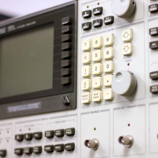 Front view of the control system analyser. Electronic device with a keyboard, buttons and a small screen