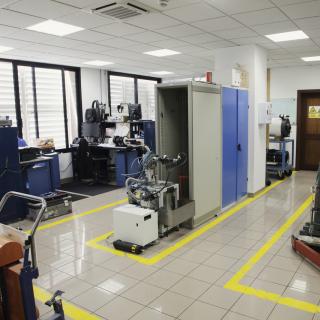 General view of the Instrument Maintenance Workshop with several work benches, cabinets and several machines under repair